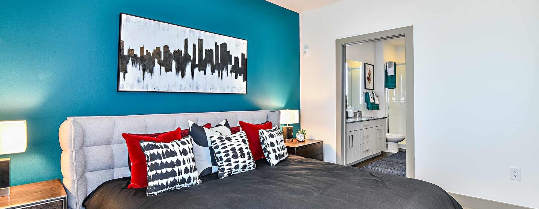 a bedroom with a bed and two nightstands