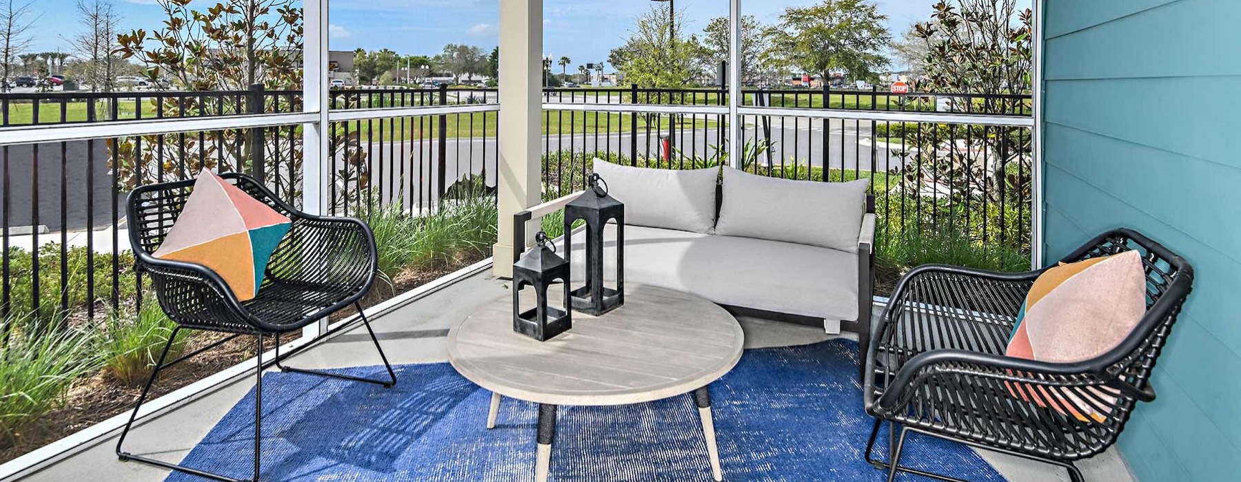 a patio with a table and chairs