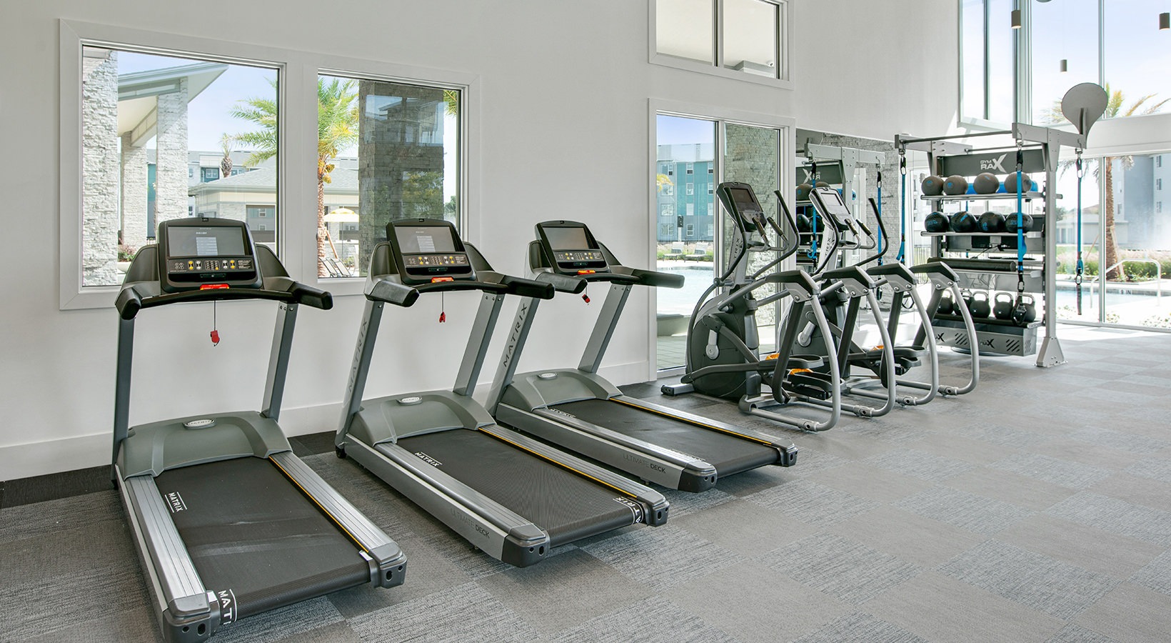 treadmills along a wall